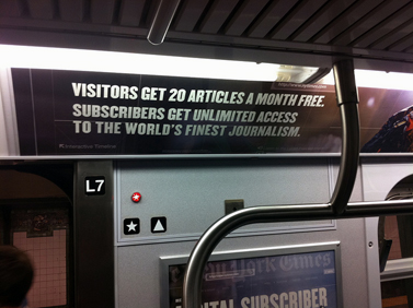 מודעה ברכבת התחתית של ניו-יורק המציגה את מודל חומת התשלום של אתר ה"ניו-יורק טיימס", יולי 2011 (צילום: ג'ייסון טסטר, גרילה פיוצ'ר, רישיון cc-by-nd)