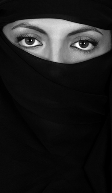 Attractive woman covered by a veil