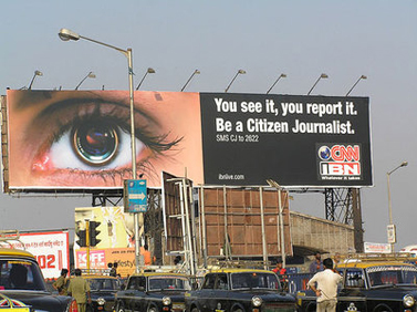 שלט פרסומת למיזם העיתונות האזרחית של CNN. בומביי, הודו (צילום: cybersoc) 