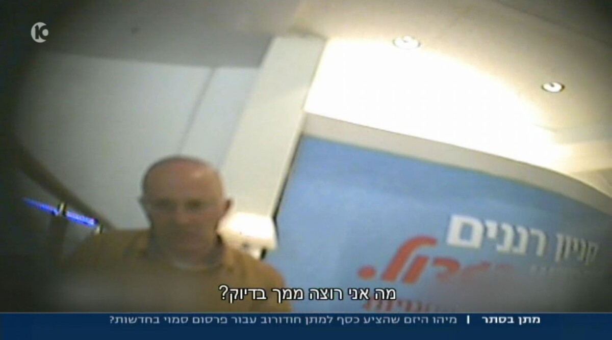 איש העסקים מאיר שרבט מצולם במצלמה נסתרת בפגישה עם מתן חודורוב, מתוך הכתבה בערוץ 10
