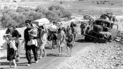 פליטים פלסטינים, שלהי 1948 (צילום: Fred Csasznik, נחלת הכלל)