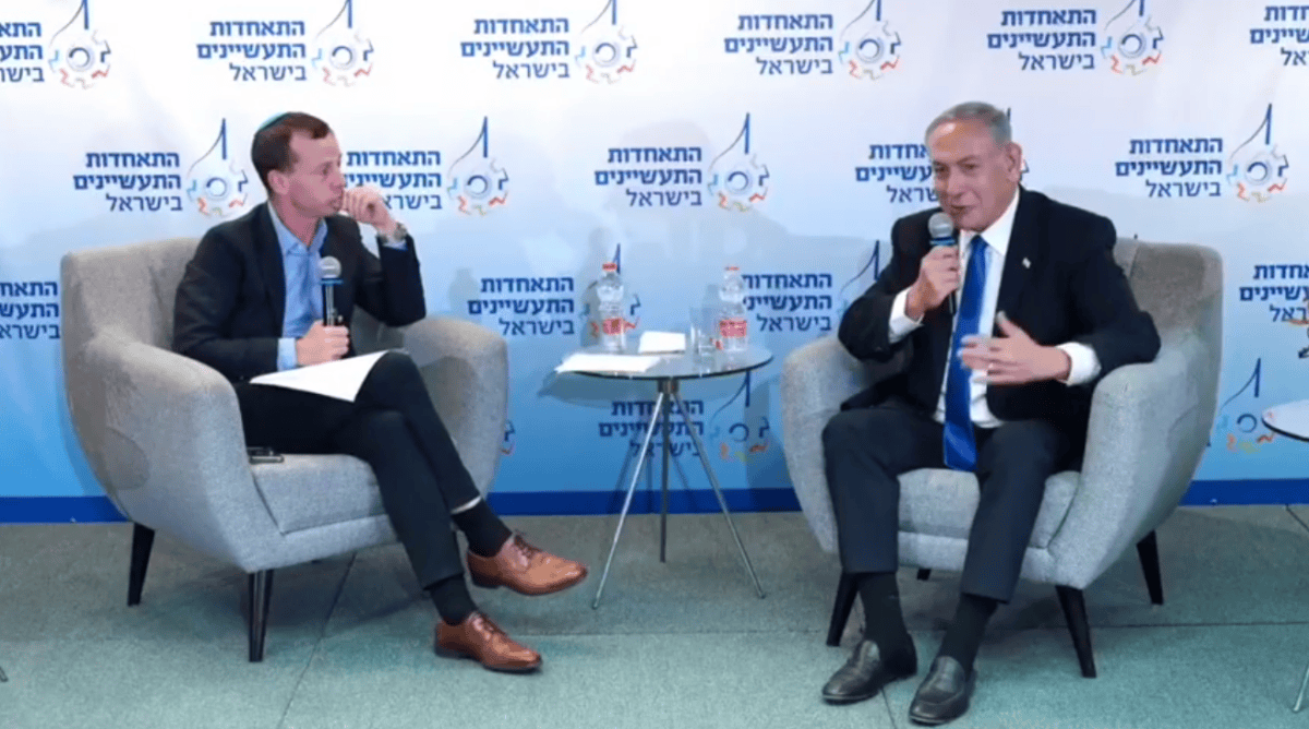 עמית סגל מופיע עם בנימין נתניהו בכנס של התאחדות התעשיינים, 19.10.2022 (צילום מסך) עמית סגל מופיע עם בנימין נתניהו בכנס של התאחדות התעשיינים, 19.10.2022 (צילום מסך)