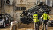 Israeli srcurity and rescue forces inspect the damage at the scene where a missile fired from Iran toward Israel caused damage in Holon, central Israel, March 15, 2026. Photo by Flash90