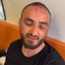 Photojournalist Mustafa al-Haruf after being beaten by Border Police officers, screenshot from Turkish television broadcasts