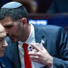 Israeli Prime Minister Benjamin Netanyahu speaks with Minister of Communications Shlomo Karhi during a 40 signatures debate, at the plenum hall of the Knesset, the Israeli parliament in Jerusalem, on January 5, 2026. Photo by Yonatan Sindel/Flash90
